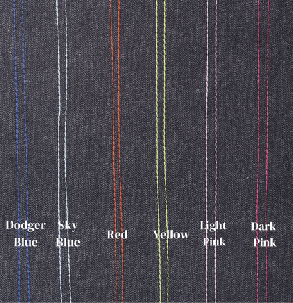 Close-up of dark fabric with colored pinstripes and labeled colors.