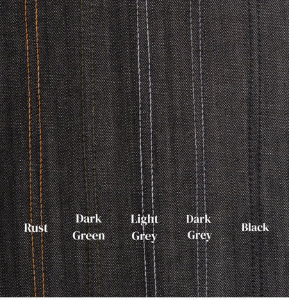 Close-up of dark denim fabric with color swatches labeled Rust, Dark Green, Light Grey, Dark Grey, and Black.